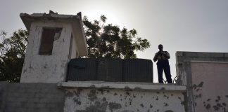 UN Photo/Tobin Jones Guard at watchtower of UN Compound in Mogadishu, Somalia (file photo, June 2013).