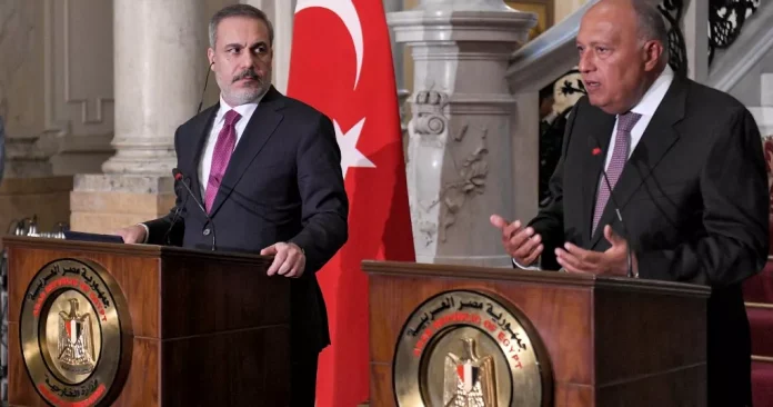 Egypt's Foreign Minister Sameh Shoukry (R) and Turkey's Foreign Minister Hakan Fidan give a joint press conference in Cairo on October 14, 2023. - Copyright © africanews AHMED HASAN/AFP or licensors