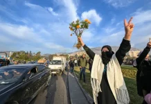 People celebrate at Umayyad Square in Damascus on December 8, 2024 [Louai Beshara/AFP]