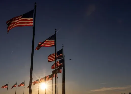 US flags flutter at the Washington Monument in Washington, DC, in February. Tierney Cross/Reuters